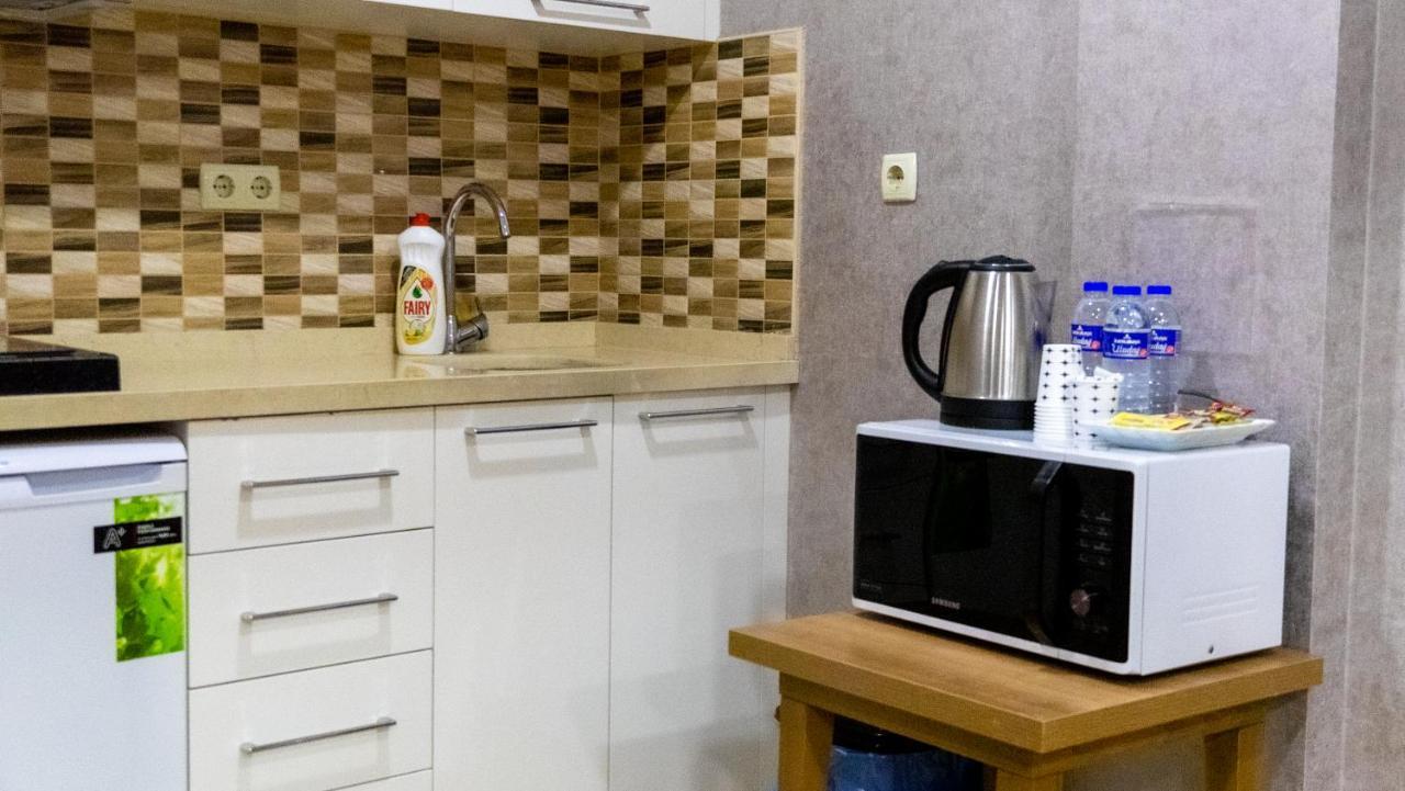 Bursa Suites Apart Otel Экстерьер фото A microwave oven in a kitchen